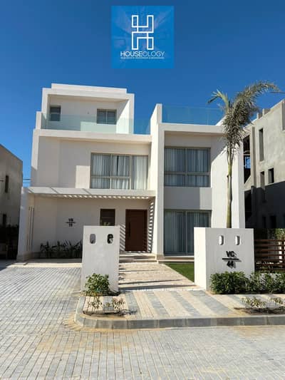 First row sea-facing townhouse with lagoon for sale in Marbay, North Coast, Ras El Hekma