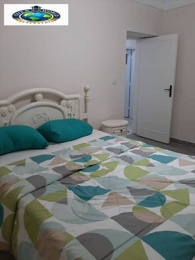 For rent, daily, furnished apartment on Al-Nasr Street next to Andalusia Hospital and Al-Lasliky Street. Elevated ground floor consisting of two bedrooms, reception, bathroom, and fully air-conditioned kitchen with Wi-Fi and natural gas. A sophisticated and quiet location close to all services for families and committed youth only.