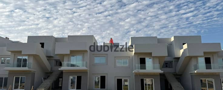 Corner townhouse villa for sale, early delivery, in V Levels, Sheikh Zayed, in front of Beverly Hills