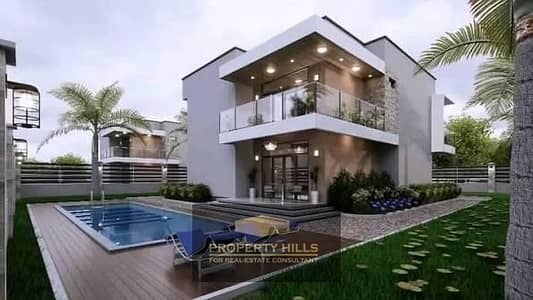 Townhouse at a bargain price, ultra-super luxury finishing, open view on the lagoon in Rock Eden compound, a few minutes from the Al-Wahat Road