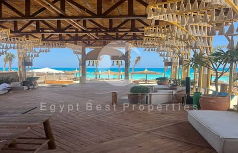 2-Bedroom Chalet by Naguib Sawiris, fully finished with ACs, prime beachfront location in Silver Sands, North Coast.