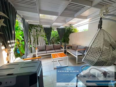 Apartment for rent with a distinctive garden in Jade Compound, New Cairo   Special finishes   Fully equipped kitchen   In front of Gate 23, Al Reh