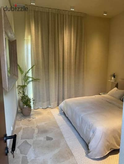 Fully finished chalet with ac's and lagoon view for sale in Ogami by SODIC, North Coast, next to La Vista Ras El Hekma