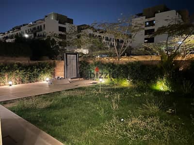 Apartment ground floor with garden for rent in Eastown Sodic ,kitchen with appliances and ACs, New Cairo city