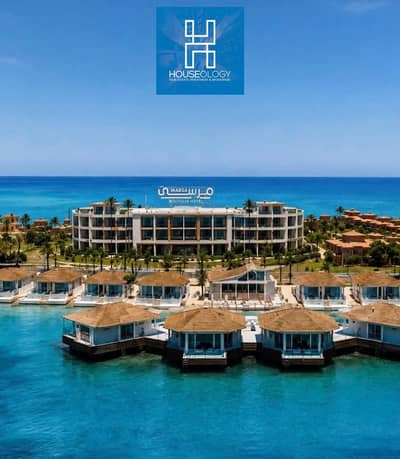 First-row beachfront hotel unit with private marina, ready to move , fully furnished with air conditioning, for sale in Marsa Marina 5.