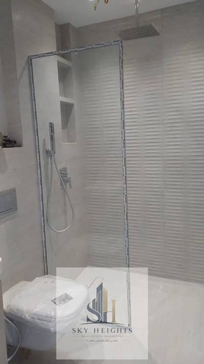 Apartment for rent, fully finished to a high standard, 99 sq m, with 2 bedrooms and 2 bathrooms. First occupancy, in Phase 9 of Al Rehab 2, next to th