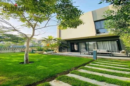 Twinhouse villa overlooking a green space in The Crown Palm Hills near Golf Views , New Giza , Swan Lake