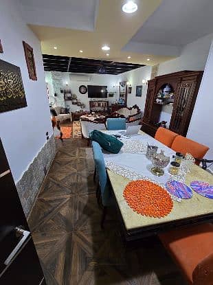 For sale, a distinguished ground floor apartment with a garden - 10th district, Sheikh Zayed - fully finished, in a lively location close to services, at a special price