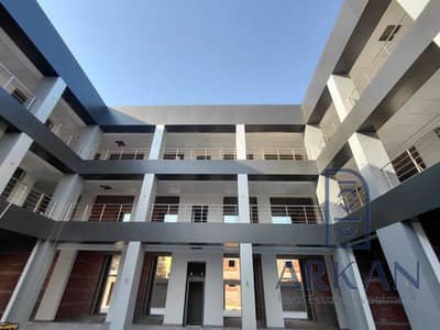 Shop 26m on Al-Mahwar Service Road, in front of Galaxy Mall and Makani, next to Al-Masreya Compound, Rawdat Al-Salima, and Green Town buildings MA