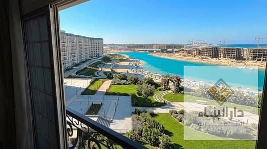 180,000 dp ready to move  lagoon view- finish apartment for sale in latin distrect new alamein north coast next to mazarine and marassi  , marina 5
