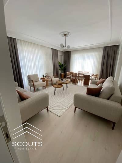 Apartment for sale for less than half its price fully finished with an open view overlooking the largest green area prime location in New Cairo