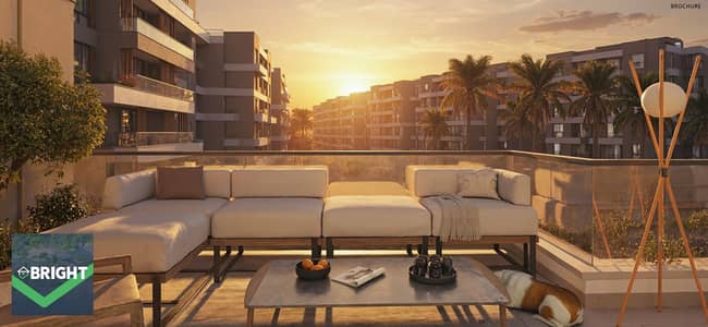 Apartment for sale in AQMAR, October Gardens, on Al-Wahat Road, inside a residential community with a strong location