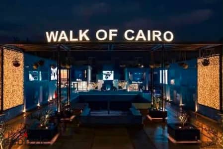 محل تجاري للإيجار دور أرضي | Walk of Cairo الشيخ زايد | 100 متر واجهة
