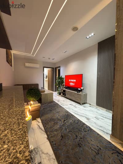 Two-bedroom hotel-style apartment on the main Faisal Street (Maryoutiya).