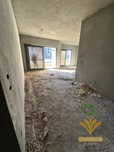 Apartment for sale 177 sqm semi-finished in the southern Lotus, New Cairo third piece from the main Teseen street, near services and transportation