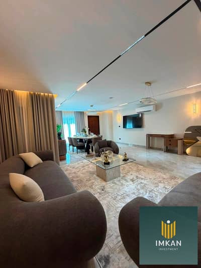 Two-bedroom apartment for sale in Mayan Al-Shorouk Compound, featuring "super-lux" finishing and a distinctive view of expansive landscaping; availabl