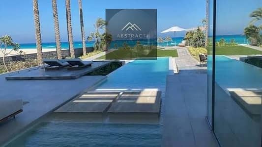 Villa for sale by the sea, marina, and towers in one shot, ready to move in, first row, furnished for sale, Marina 5, San El Wazira, North Coast, next