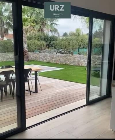 Own a villa with 12-year installments facing the largest landscape plot in a compound connecting Fifth Settlement and Mostakbal City near Privado