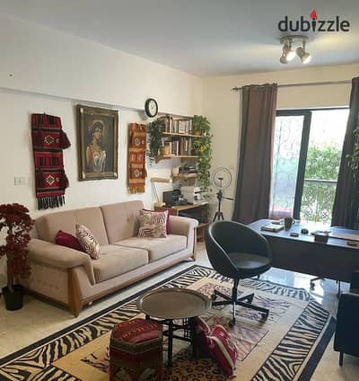 89 sqm unfurnished ground floor apartment for rent in Al Rehab 2, Phase 9, with a private 50 sqm garden. Rent includes kitchen. Close to services.