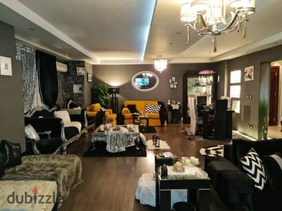 Ground floor apartment with garden for sale in Phase 9 of Al Rehab, ready to move in with furniture and appliances