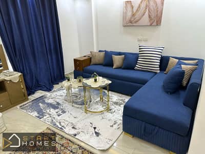 Furnished 1-bedroom ground-floor studio (56 sqm) for rent in Madinaty (B12); features custom finishes and a balcony with custom detailing.