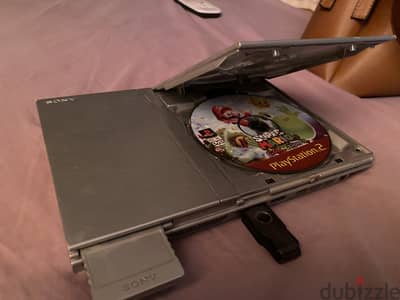 Playstation 2 slim بفلاشه العاب و دراع و وصلات