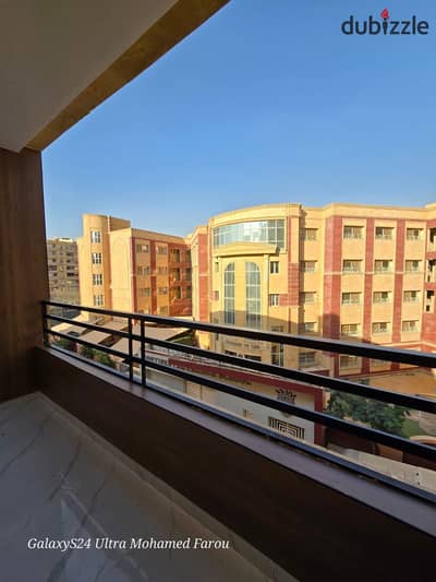 For sale, one of the best apartments available at Al Ahram Gardens, a very prime location, steps to services, a modern building without shops, open view onto Intercontinental School, steps to the club and mall.