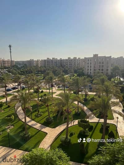 221m² apartment for sale in Al Rehab City (Phase 5, The Condo); features developer-standard finishing and a magnificent view overlooking a garden, the