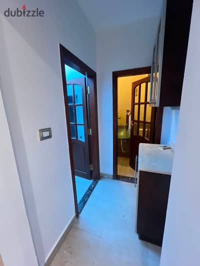 For rent, an apartment of 180 meters in Al-Rehab 1, ground floor with a 50-meter garden, 3 bedrooms including a master bedroom with dressing, another room with dressing, 3 bathrooms, reception area, 3 rooms, kitchen, special finishes with marble and imported bathrooms. The apartment is in a central area very close to gates 13, 17, and 19, near the market and the church, and around.