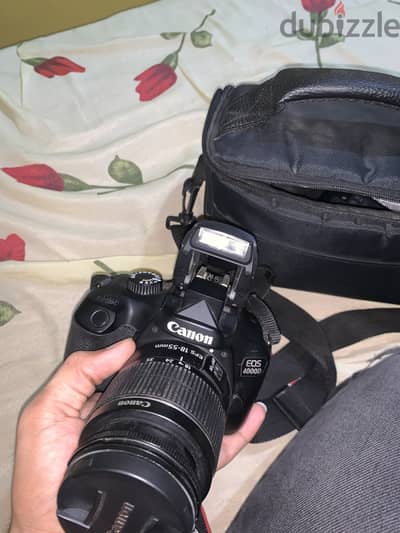  العدسة: Canon 18-55mm  بطارية  كارت ميموري  شنطة الكاميرا  م