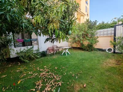 Ground-floor apartment for rent in Hadayek Al-Mohandessin Compound, Sheikh Zayed City. 90 sqm interior area with an 85 sqm garden; fully furnished.