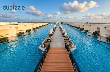 شاليه تشطيب بالكامل علي فيو الاجون في راس الحكمه للبيع بموقع استراتيجي داخل دايركشن وايت