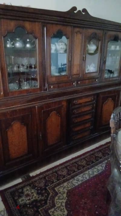 dining table with niche with chairs and cushions