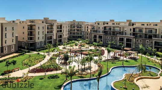 Apartment for rent in October Plaza compound, 6 October, behind Mall of Arabia and near Jamal Abdel Nasser Axis, with kitchen and air conditioning, 198m