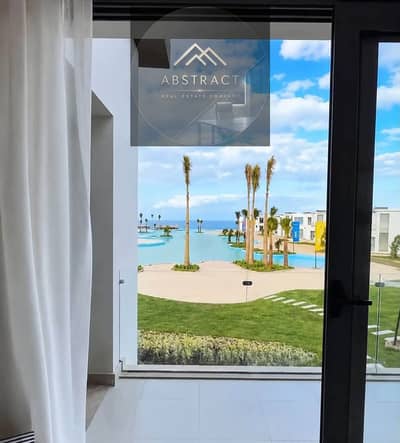 The sea, marina, and towers all in one view. **Immediate delivery — fully furnished, first-row villa for sale in Marina 5, Wizarat Peninsula, North Co