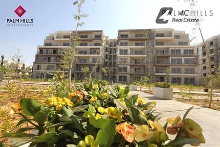 Lowest price apartment with private garden in Palm Hills, Fifth Settlement, with a distinctive layout and open view landscape, ready for viewing