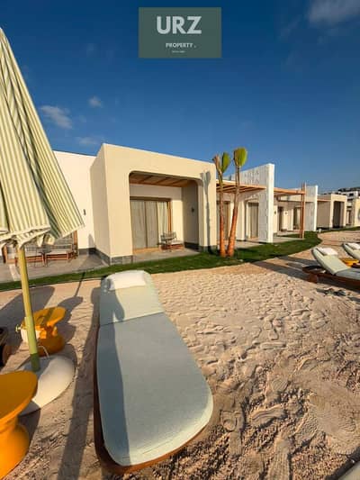 فرصة للاستثمار او سكن شالية غرفتين ارضي بجاردن ومدخل خاص lagoon frist row بتشطيب كامل مع التكيفات في راس الحكمة الساحل الشمالي بالقرب من ماونتن فيو