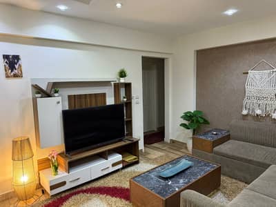 Furnished apartment for rent in Beverly Sheikh Zayed, featuring hotel-style furnishings, a private entrance, a prime location, and a wonderful view.