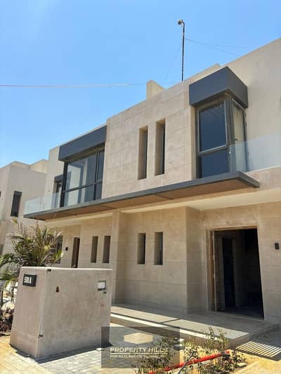 Get a villa immediately at a special price with a lagoon view in Karma Gates, Sheikh Zayed, directly on Dahshour Link, opposite Beverly Hills