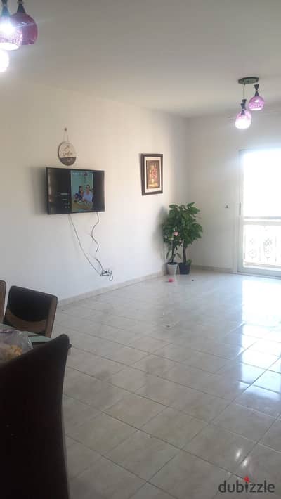 Unfurnished 131-square-meter apartment for rent in Al Rehab 2, next to Avenue Mall, with a garden view.