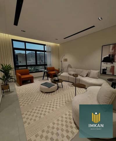 A 10% down payment apartment for sale with a lagoon view, finished, in installments over 7 years in Aljar British Compound, in front of Madinaty
