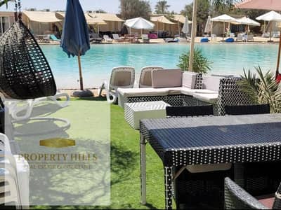 Ground chalet for sale next to Almazah Bay, with 3 master bedrooms + nanny room, fully finished with Double View Lagoon and landscaping, with only 5% down payment
