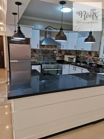 For sale: Apartment with a fully finished garden, complete with kitchen and air conditioning, in a prime location in Zayed Dunes Compound, Sheikh Zaye