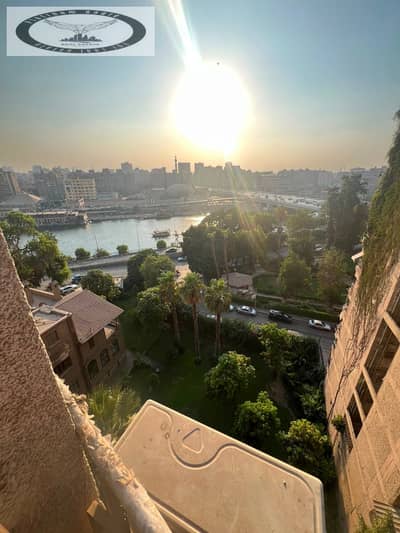Fully furnished apartment for sale in Zamalek (including kitchen and A/C units). Prime location with a Nile view; includes a share of the land.