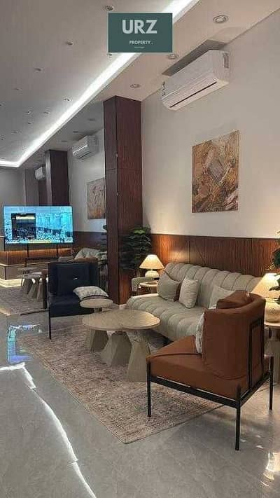عاين واستثمر بامان شقة فندقية تشطيب كامل بالتكيفات والمطبخ في شيراتون للبيع علي طريق  النصر و الاوتستوراد بالقرب من مطار القرب وبحوار تاج سيتي وستودا