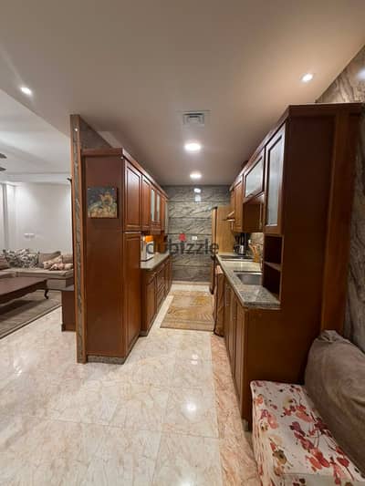 Furnished ground-floor hotel-style studio with a garden for rent, next to Gateway Mall.