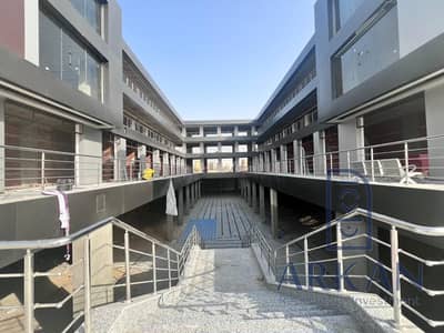 Store 42m on Al-Mahwar Road, in front of Galaxy Mall, and adjacent to Beit Al-Masria Compound, Rawdat Al-Salimah, and Green Town Buildings KB