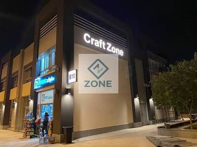 Shop for sale in Madinaty, 74 square meters, super deluxe finishing, in Kraft Zone, with immediate return on investment.
