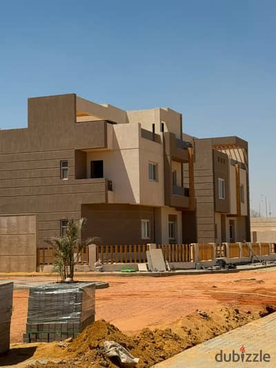 Own a distinctive 293 sqm townhouse, ready for delivery within 6 months, in an established compound in New Zayed, Green Belt Area, Basin 1.