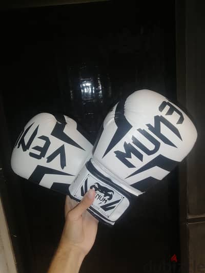 Venum boxing gloves with hand wraps